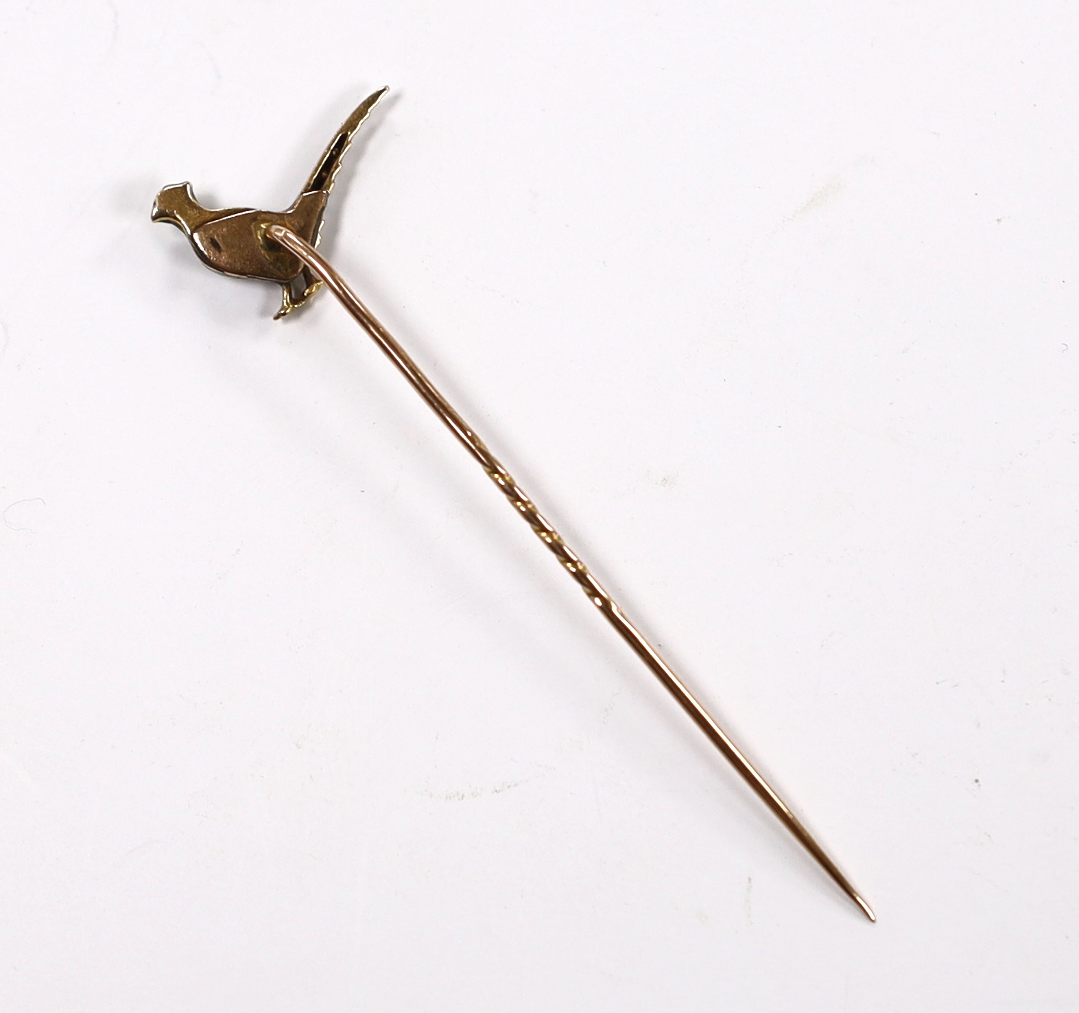 An Edwardian yellow metal, enamel and rose cut diamond set pheasant stick pin, 68mm, gross weight 2.1 grams.